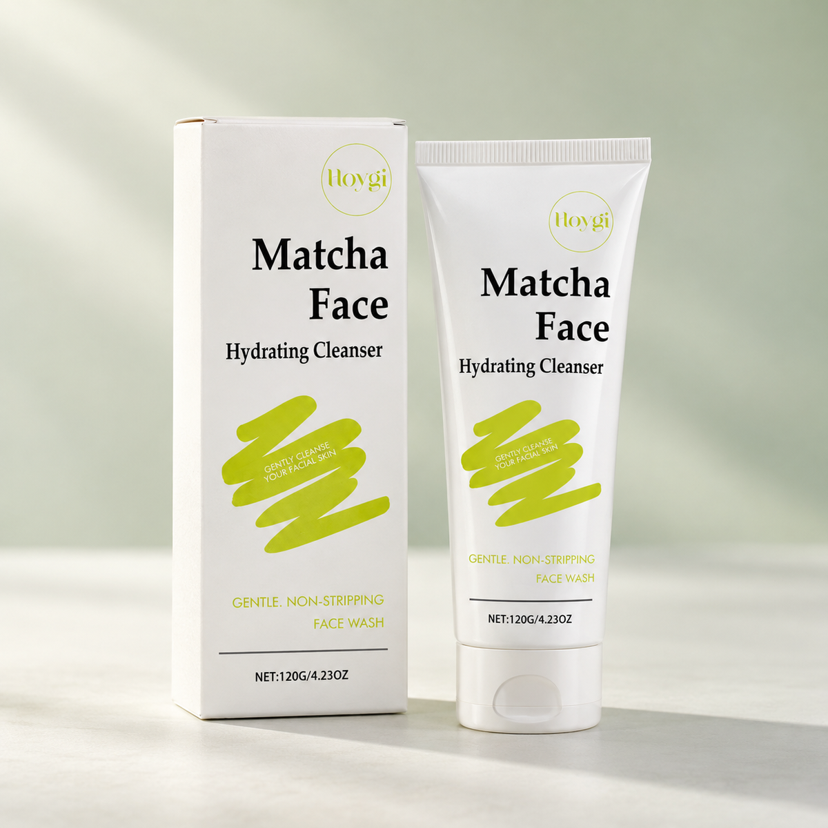 Komplexion matcha face cleanser tube and box on a pale green background