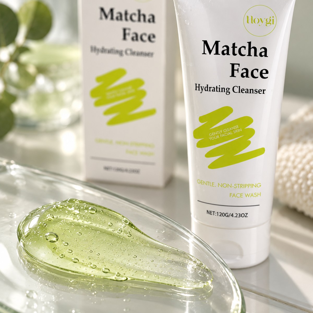 Clear green cleanser gel on a glass dish beside the matcha face cleanser